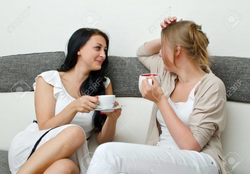 14584024 Two Women Friends Chatting Over Coffee At Home