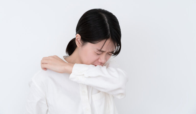 Asian Woman Coughing On White Background